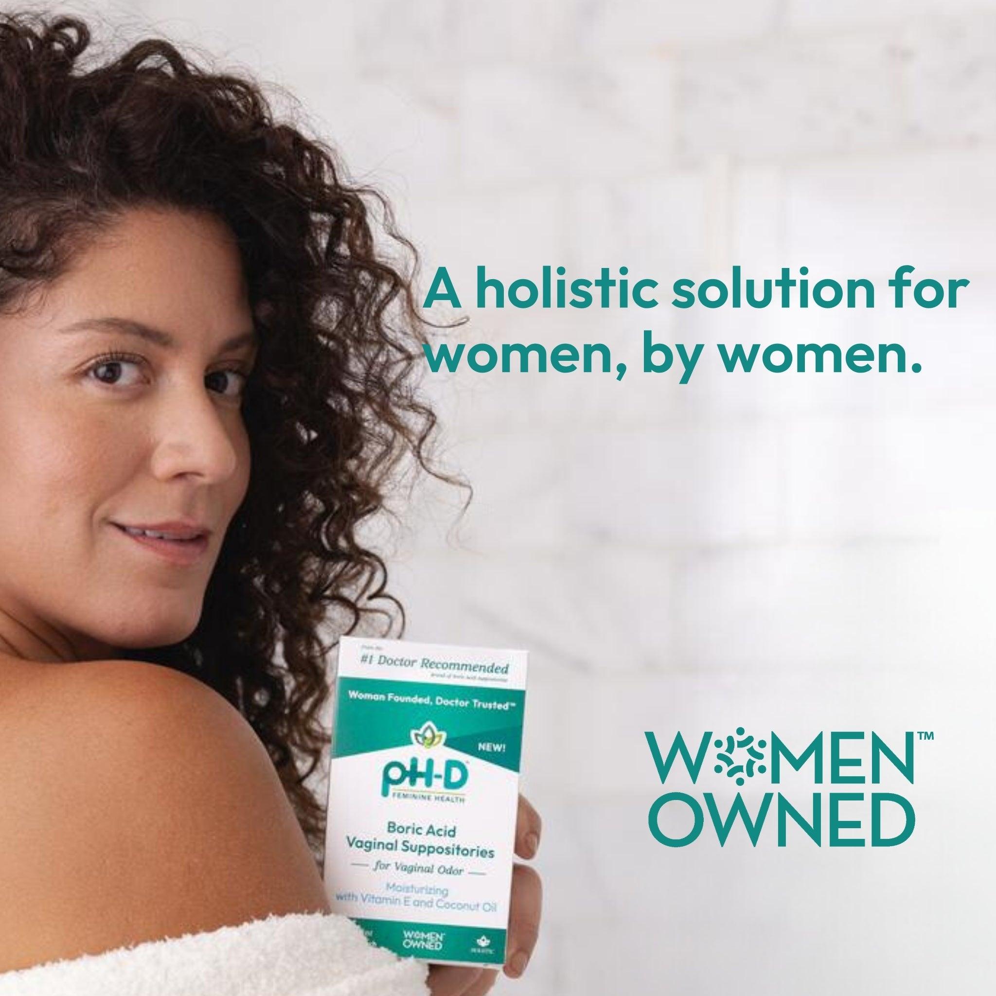 A woman smiling holding a pack of pH-D Moisturizing Vaginal Suppositories.