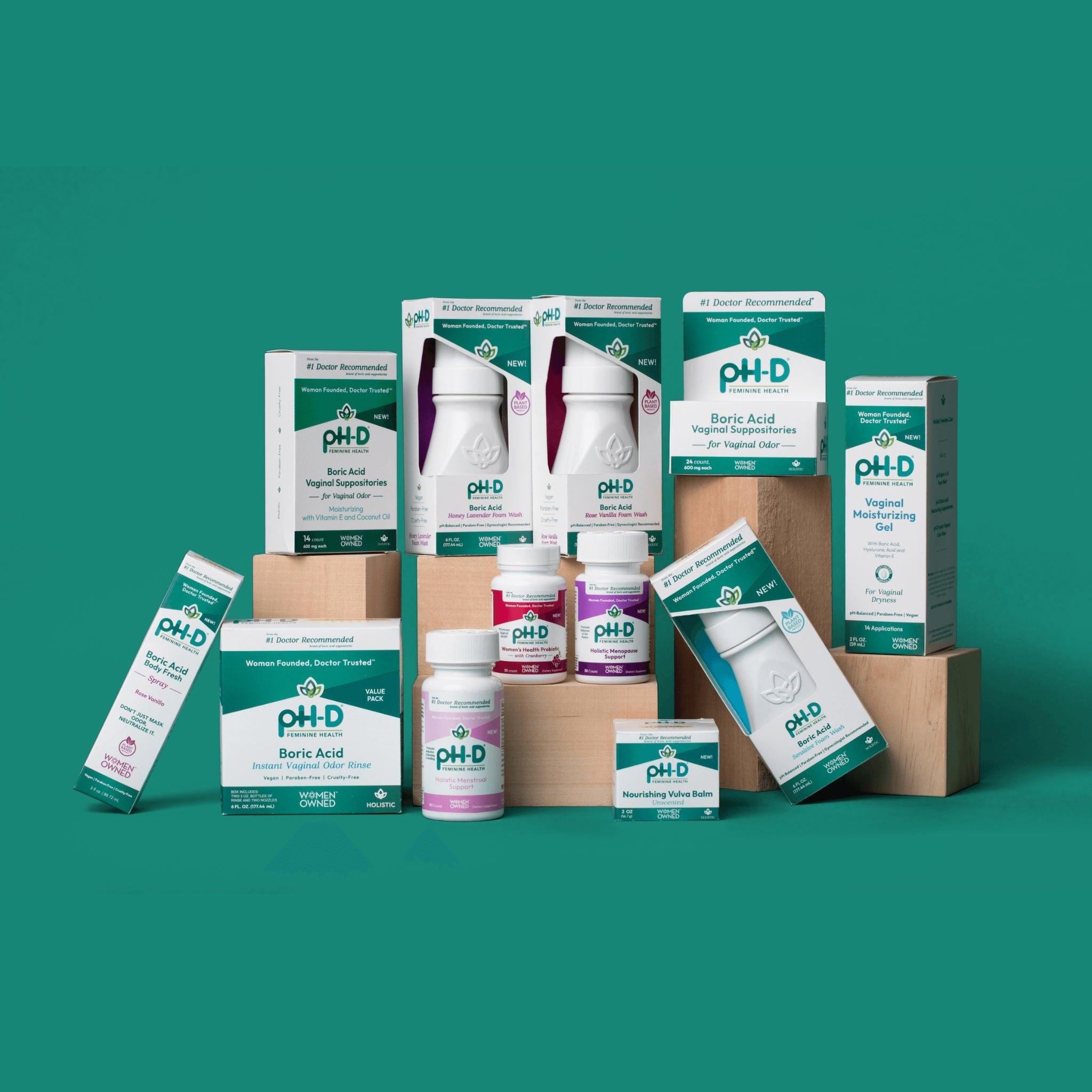 pH-D Feminine Health full product line, including boric acid suppositories, foam washes, moisturizing gel, and more, displayed against a teal background.